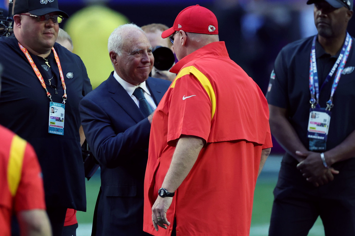 Kansas City Chiefs head coach Andy Reid meets with Philadelphia Eagles owner Jeffrey Lurie on the field before Super Bowl LVII at State Farm Stadium.
